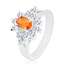 Inel de culoare argintie, zirconiu oval portocaliu cu margine transparentă